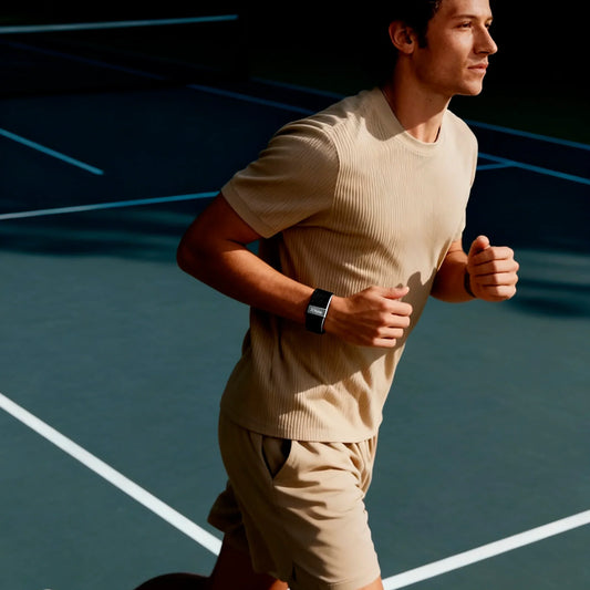 Man running wearing Hume Health Band